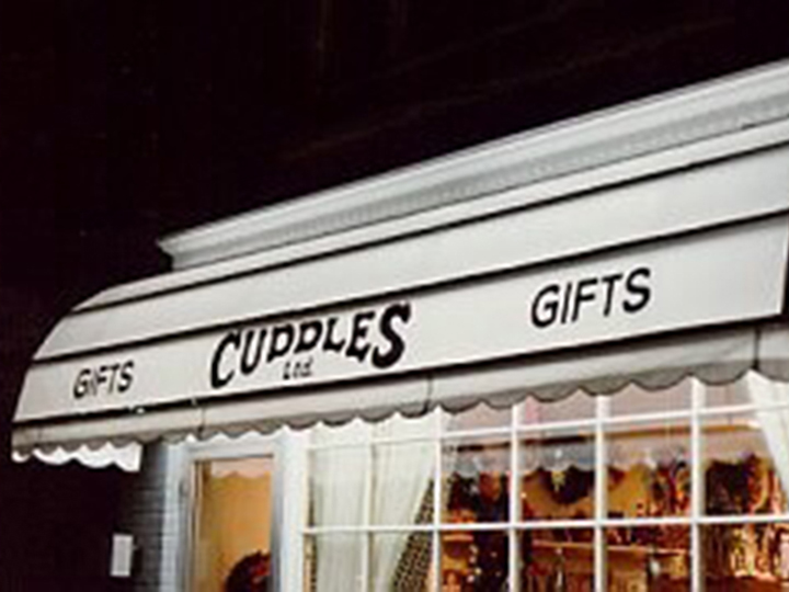 Cuddles Gifts awning in front of store